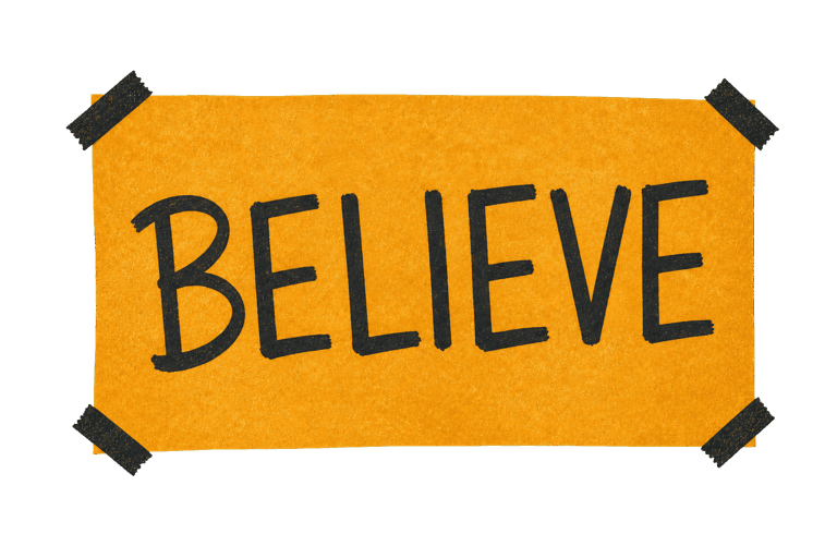 A handmade orange Believe paper note held in place with black tape